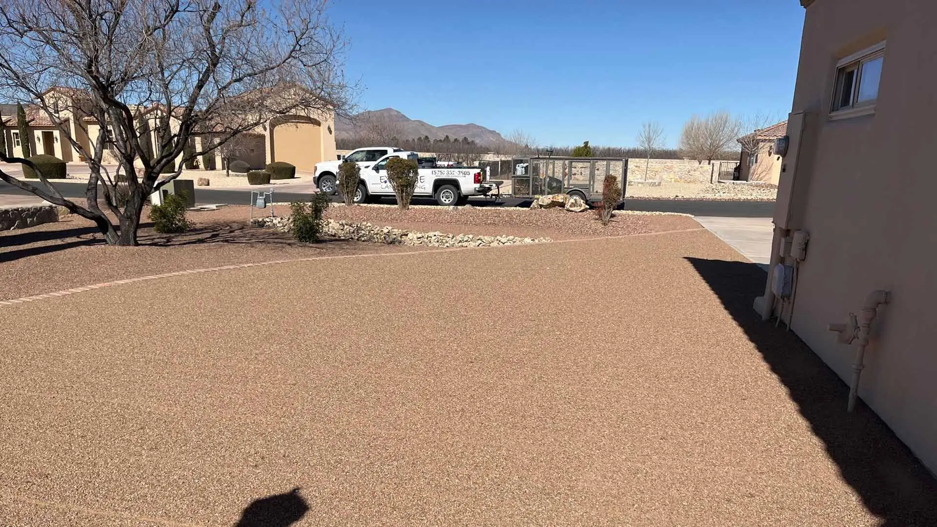 Branded work truck displayed by serviced lawn in Mesilla, NM.
