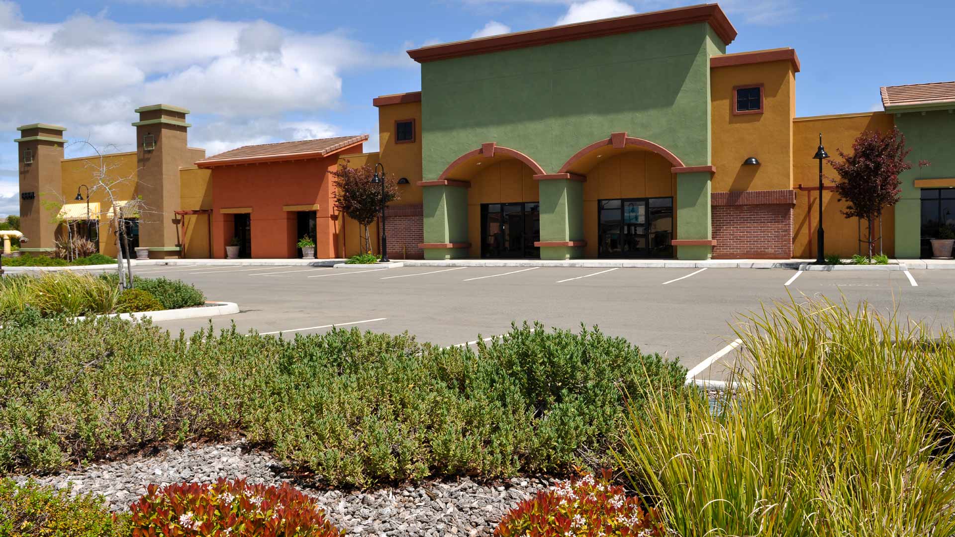 A commercial property's landscape maintained by professionals in Las Cruces, NM.
