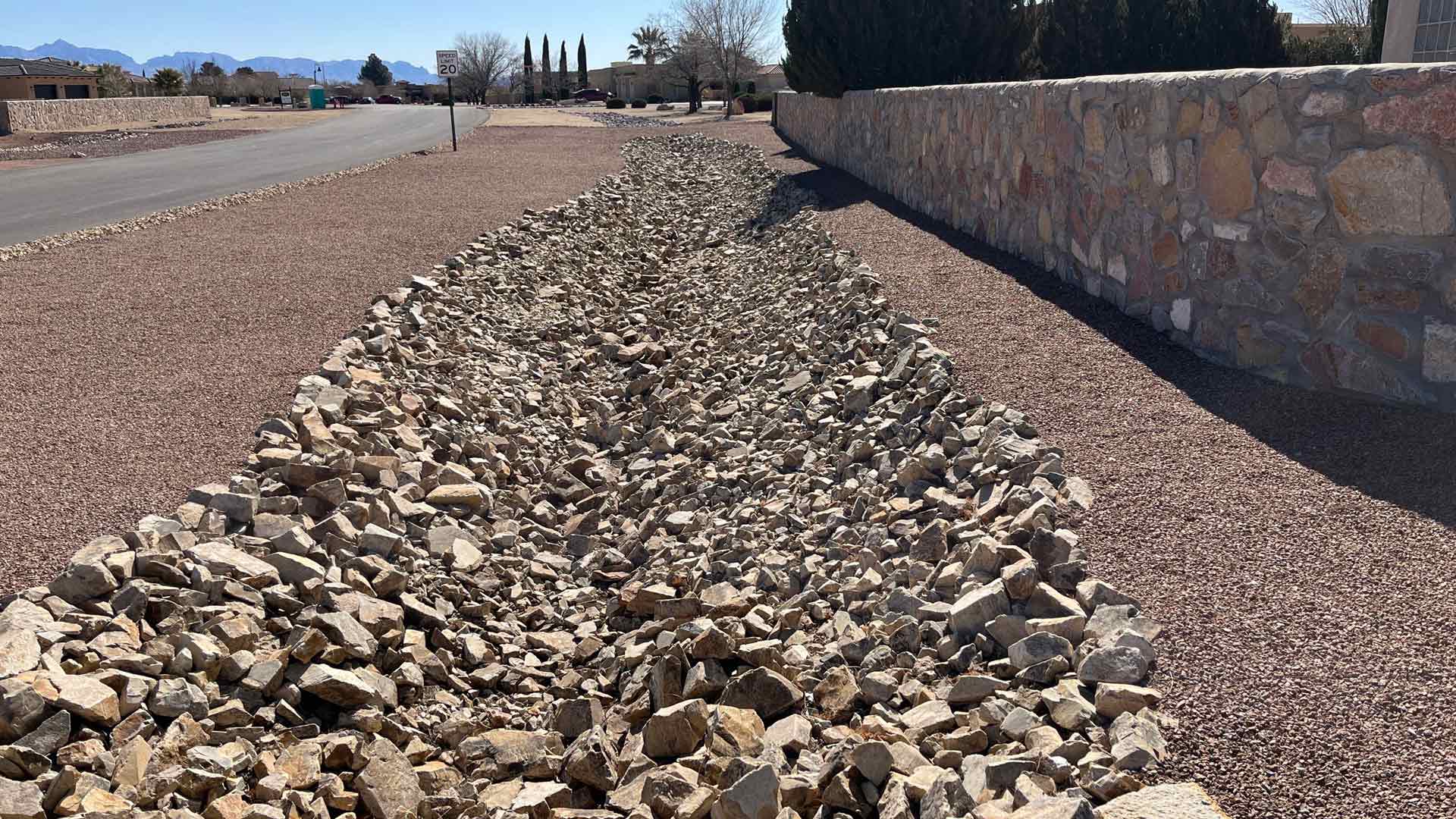 A dry creek bed drainage solution installed in El Paso, TX.