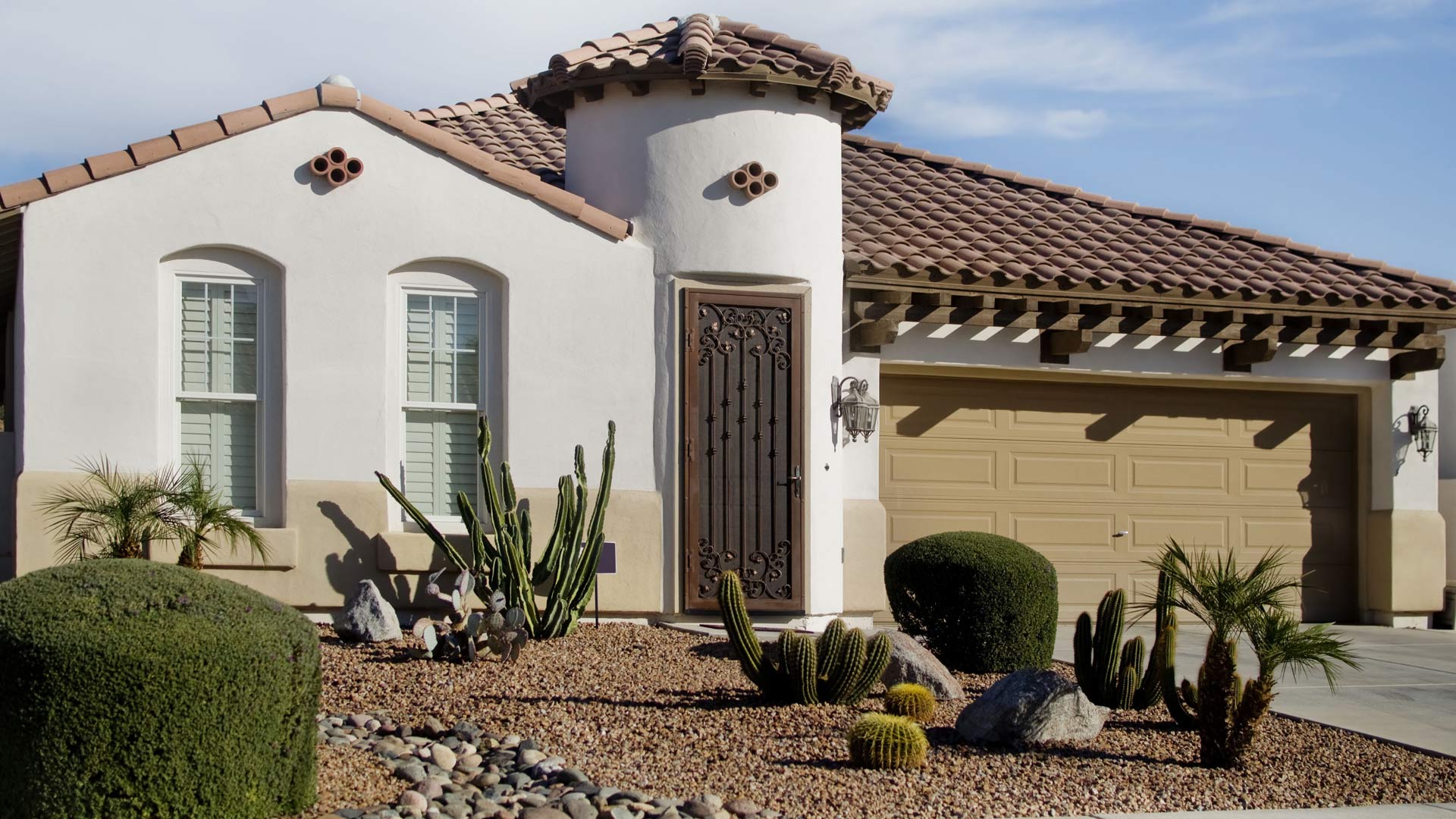 A home with rock installed and landscape maintained in Santa Teresa, NM.