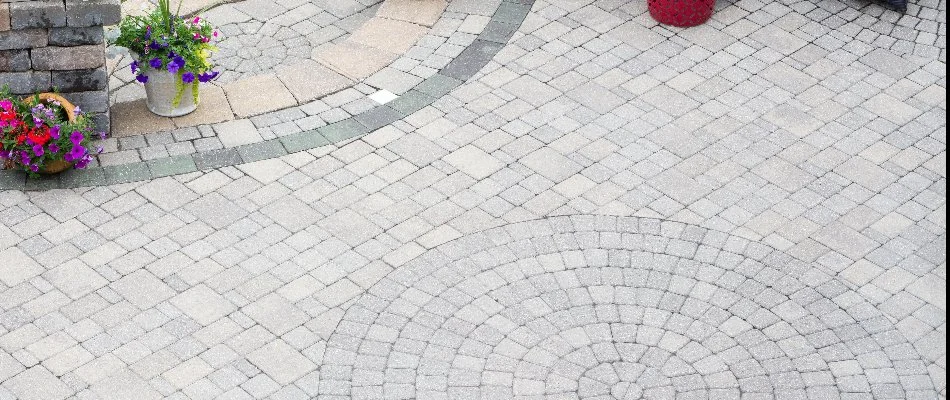 Paver patio arranged in a unique pattern.