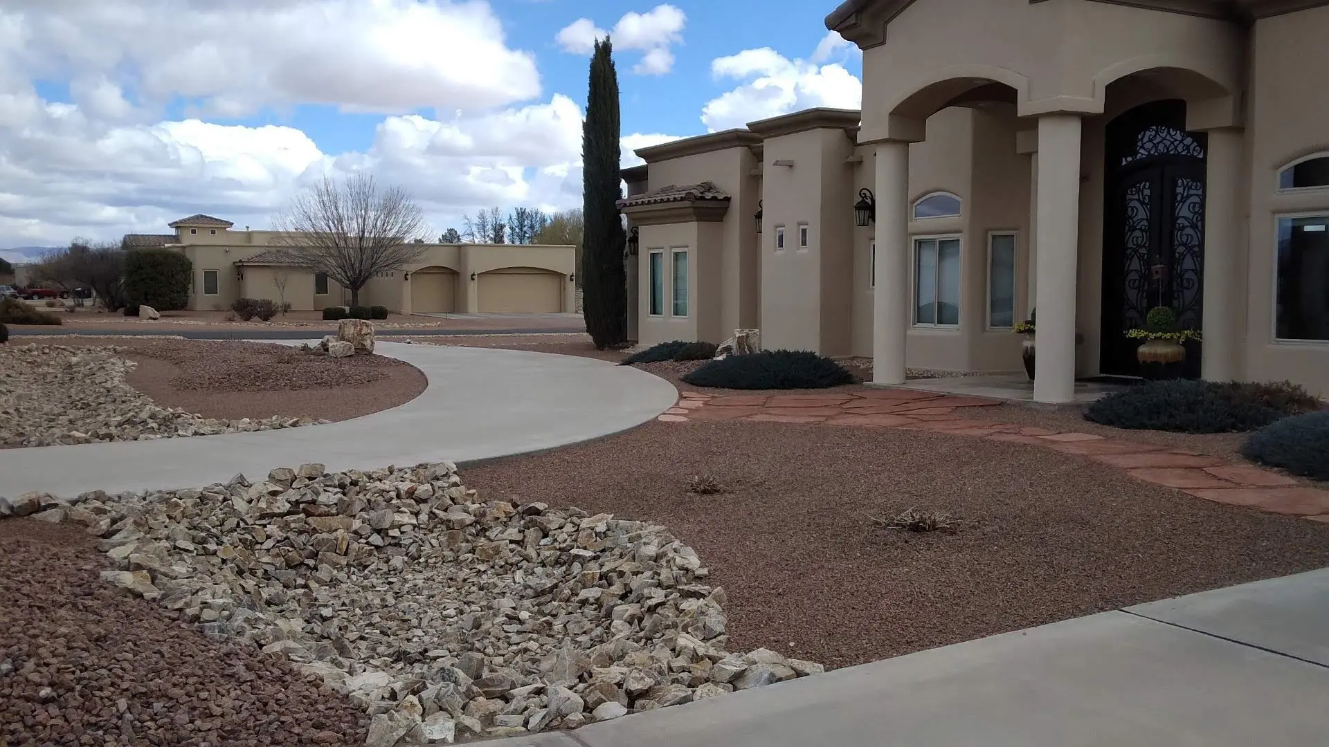 Landscape for a home filled with rock in Las Cruces, NM.